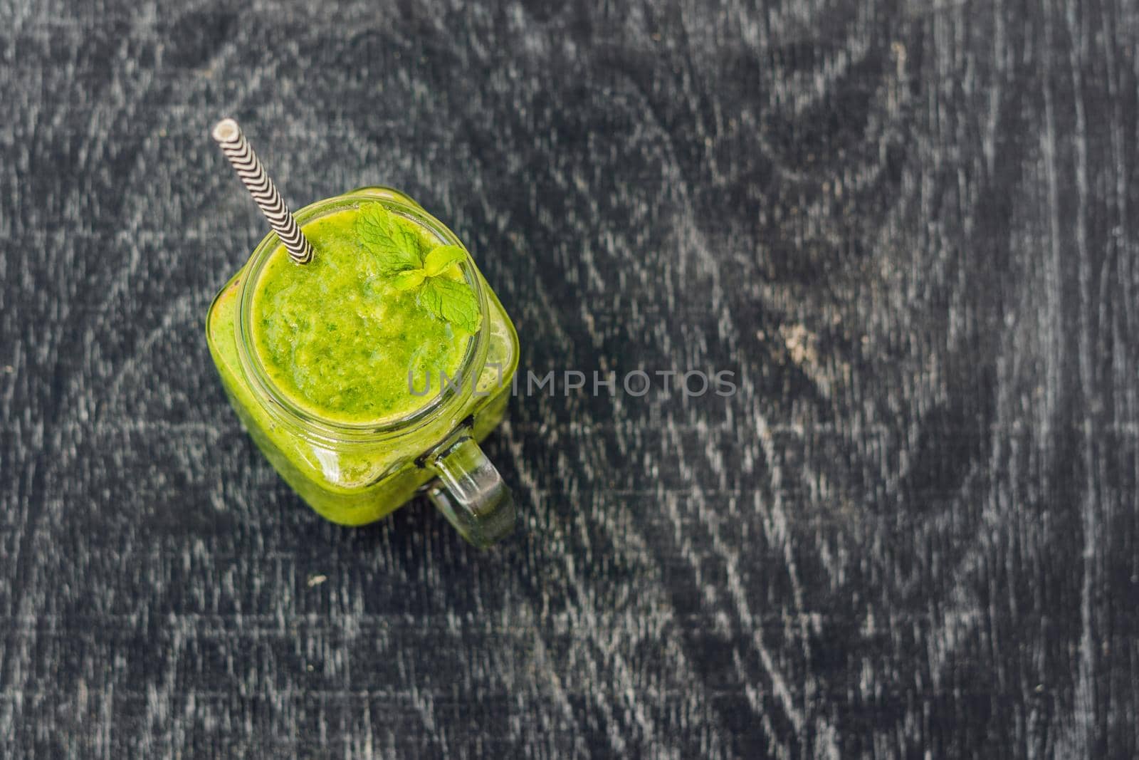 Green smoothies made of spinach. Healthy eating and sports concept by galitskaya