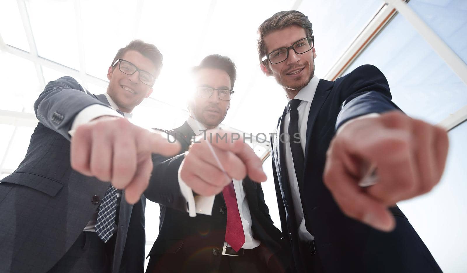 We choose you! three business men pointing at you.the concept of choice
