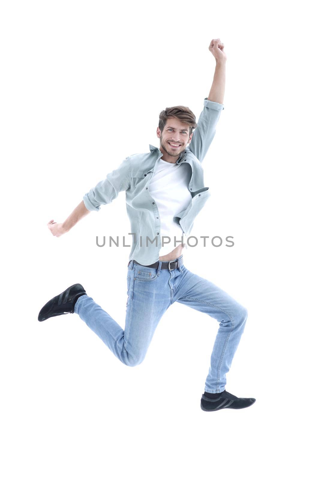 happiness, freedom, movement and people concept - smiling young man jumping in air