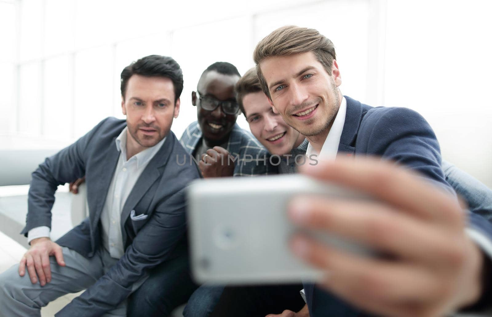 close up.a group of young employees takes a selfie.photo with copy space