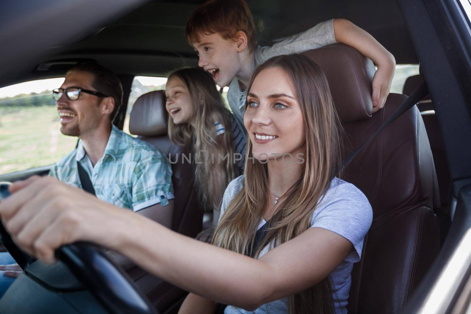 close up. a young family with children traveling in the car.family holiday concept