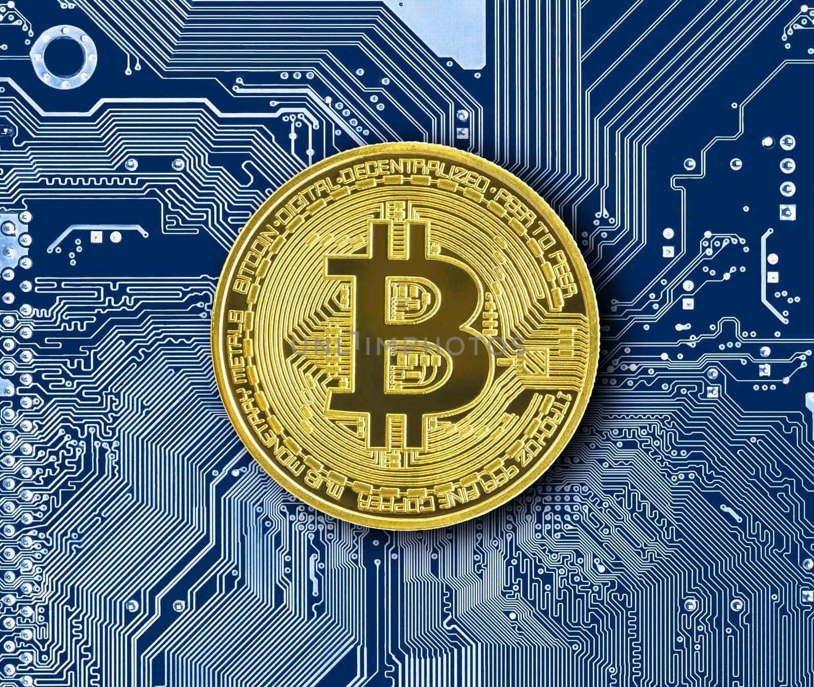 Bitcoin coin on blue circuit board by stoonn
