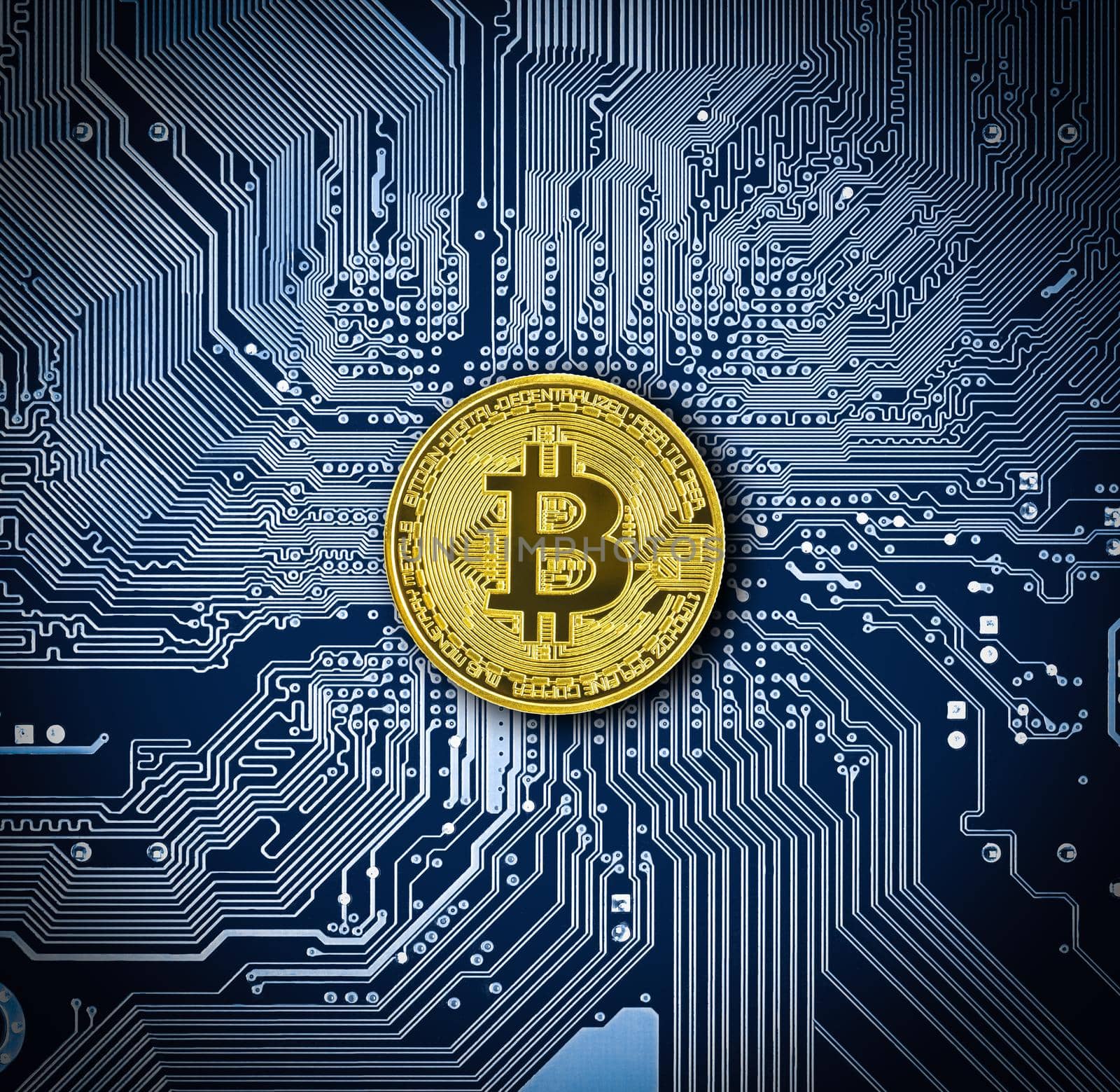 Bitcoin coin on blue circuit board by stoonn