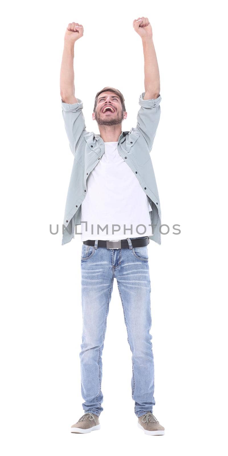 in full growth. a very happy young man .isolated on white background