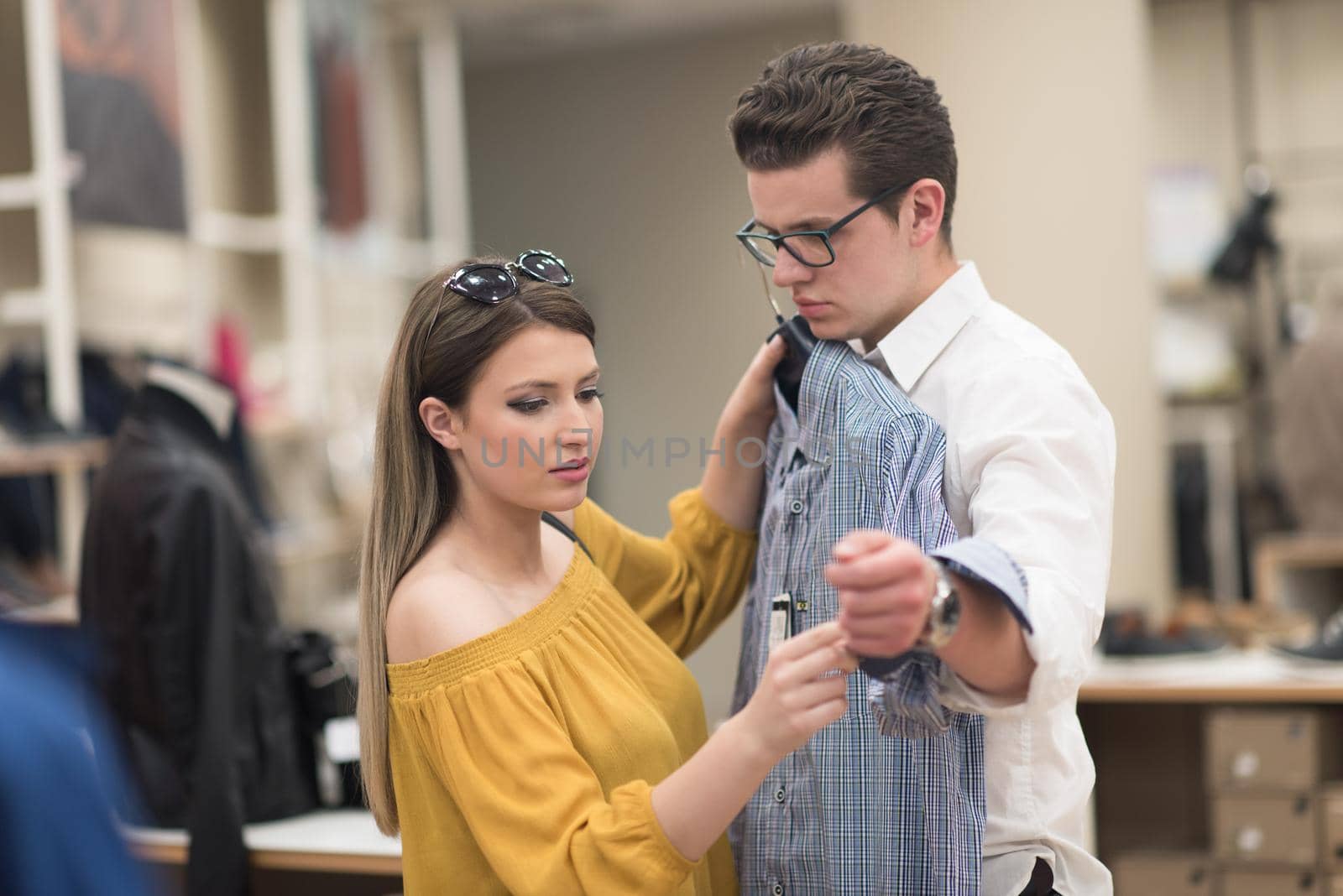 Attractive Couple Shopping In A Man's Clothing Store