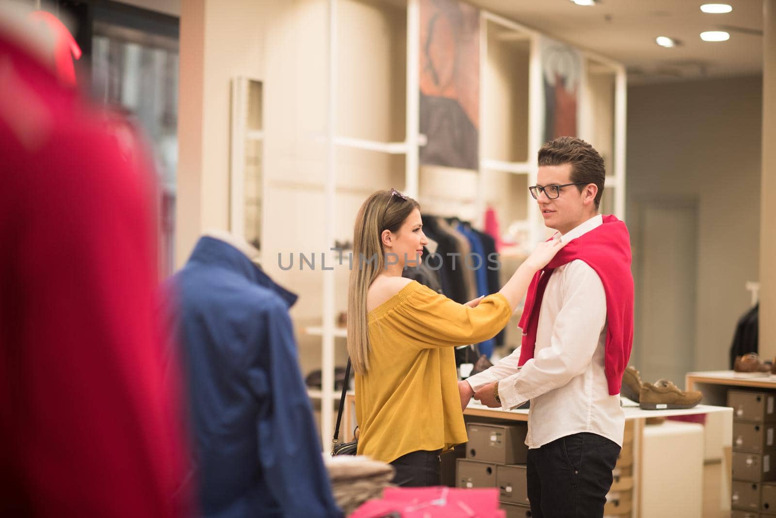 Attractive Couple Shopping In A Man's Clothing Store