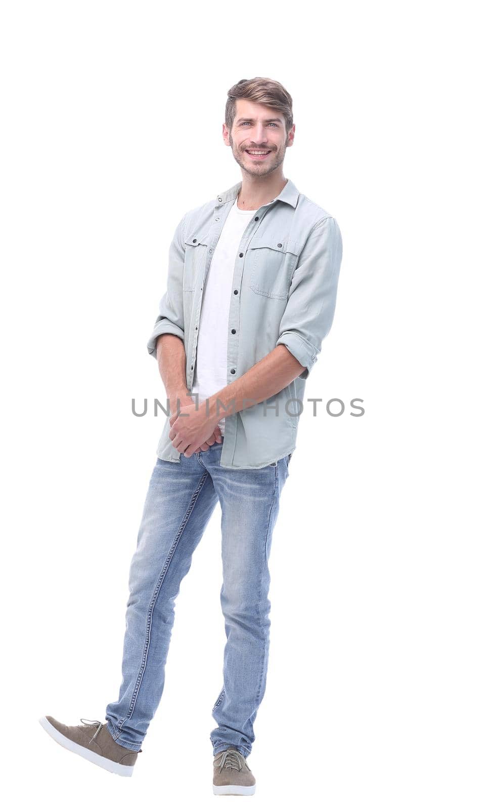 in full growth. modern young man in jeans.isolated on white background