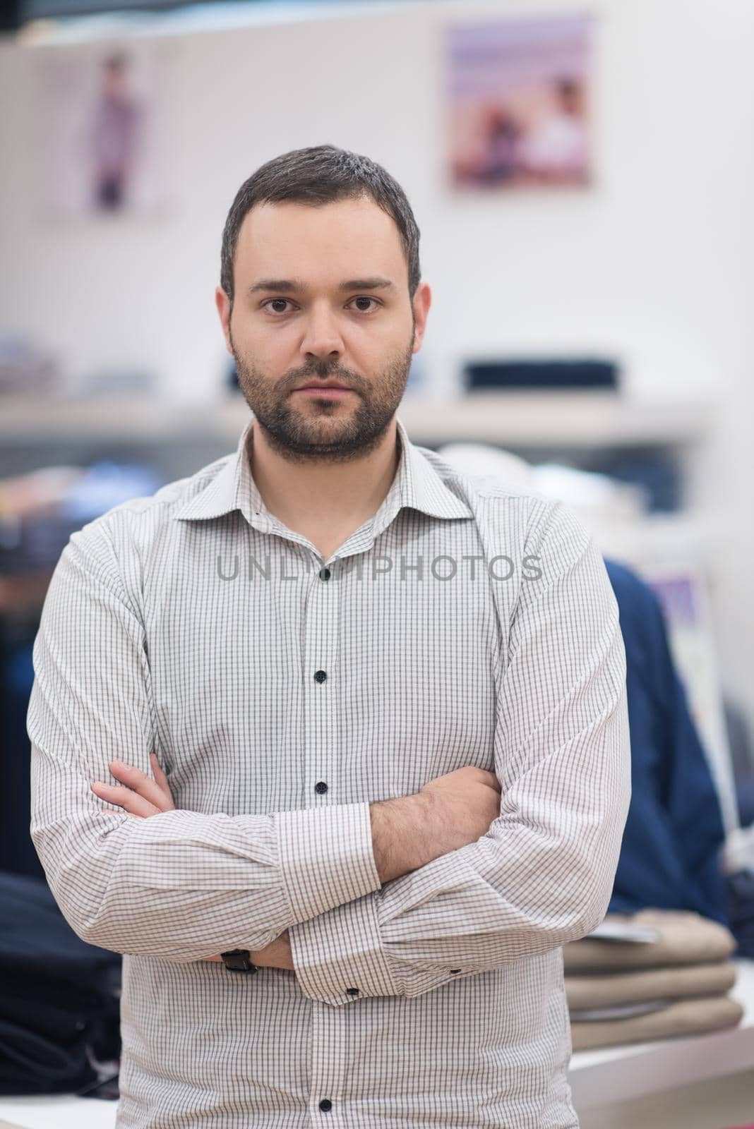 Portrait of an attractive man Shopping In A Man's Clothing Store