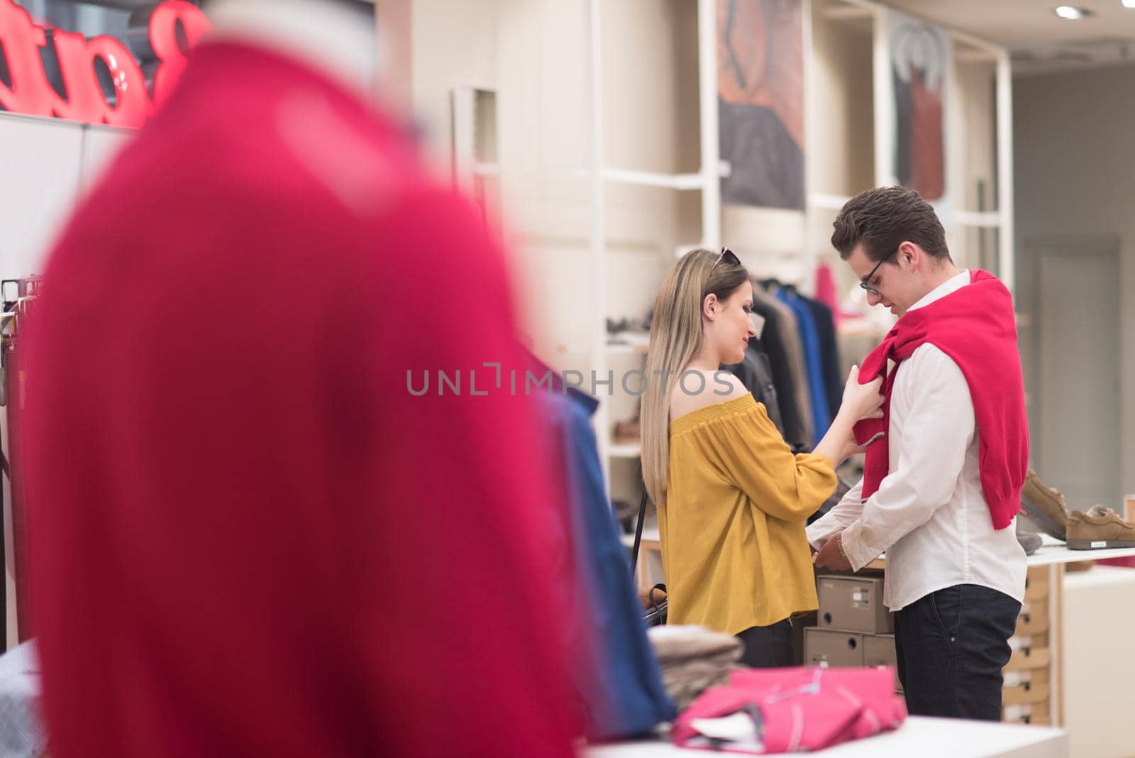 Attractive Couple Shopping In A Man's Clothing Store