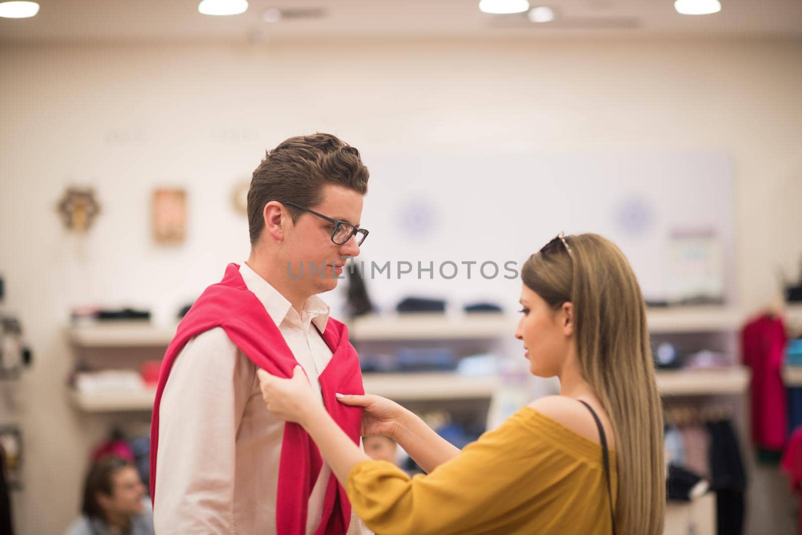 Attractive Couple Shopping In A Man's Clothing Store