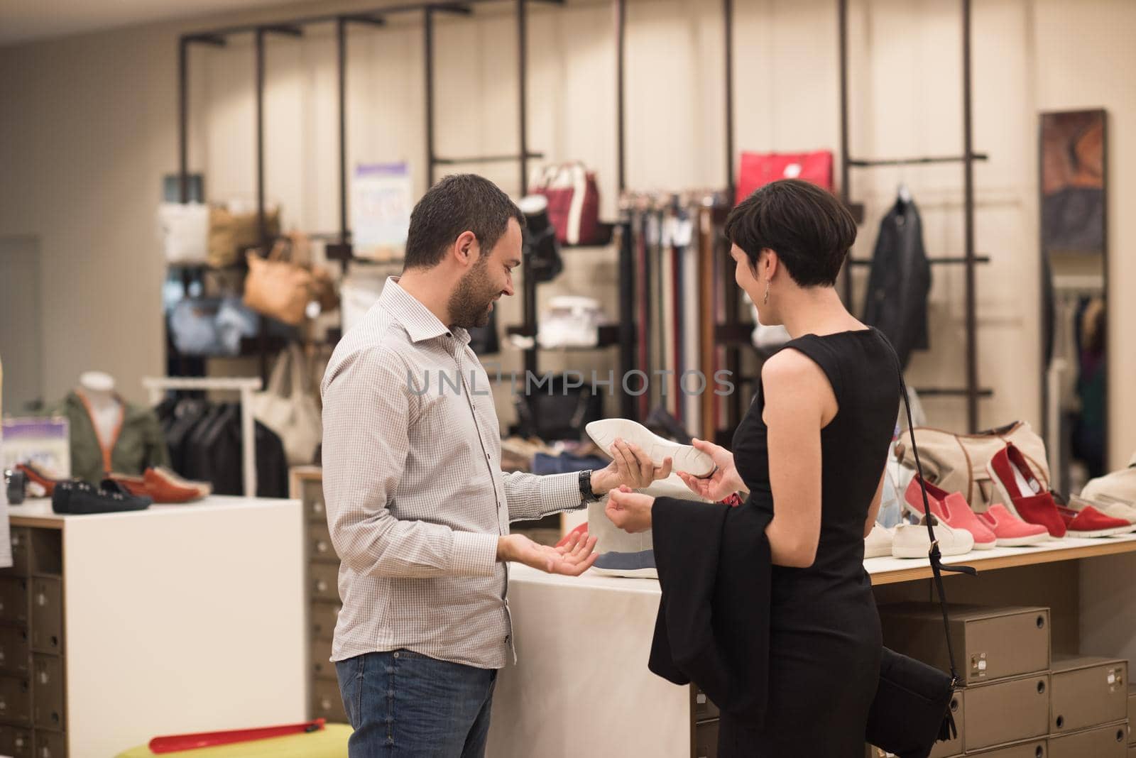 couple chooses shoes At Shoe Store by dotshock