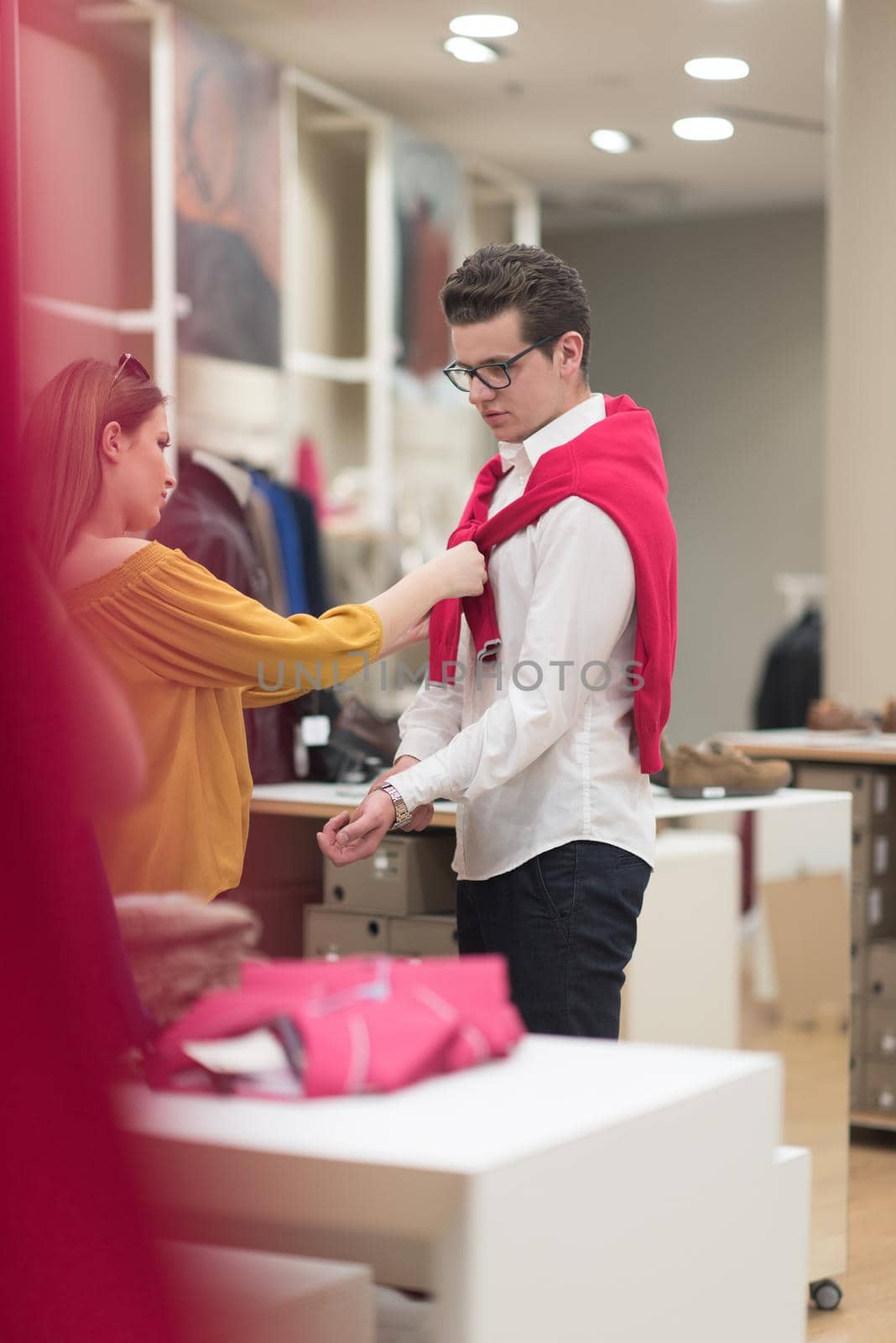 Attractive Couple Shopping In A Man's Clothing Store