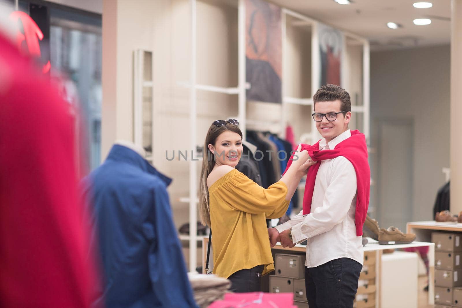 Attractive Couple Shopping In A Man's Clothing Store