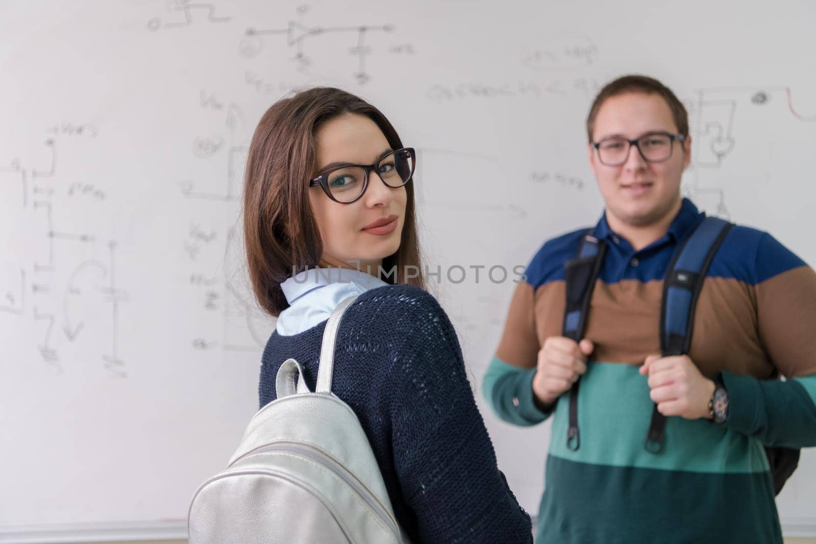 portrait of young students in front of chalkboard by dotshock