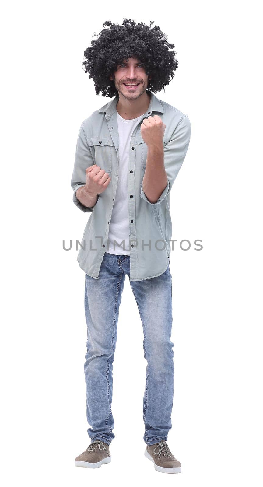 in full growth. portrait of a happy young man .isolated on white background