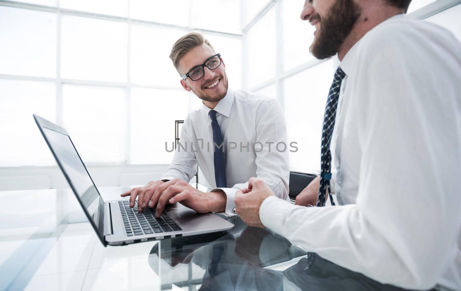 smiling employees at the Desk in the office.photo with copy space