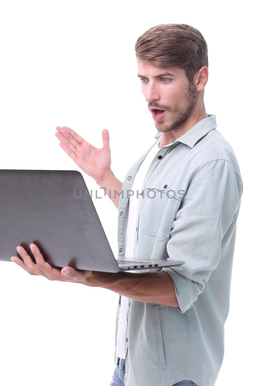 close up. successful young man with a laptop .isolated on white background