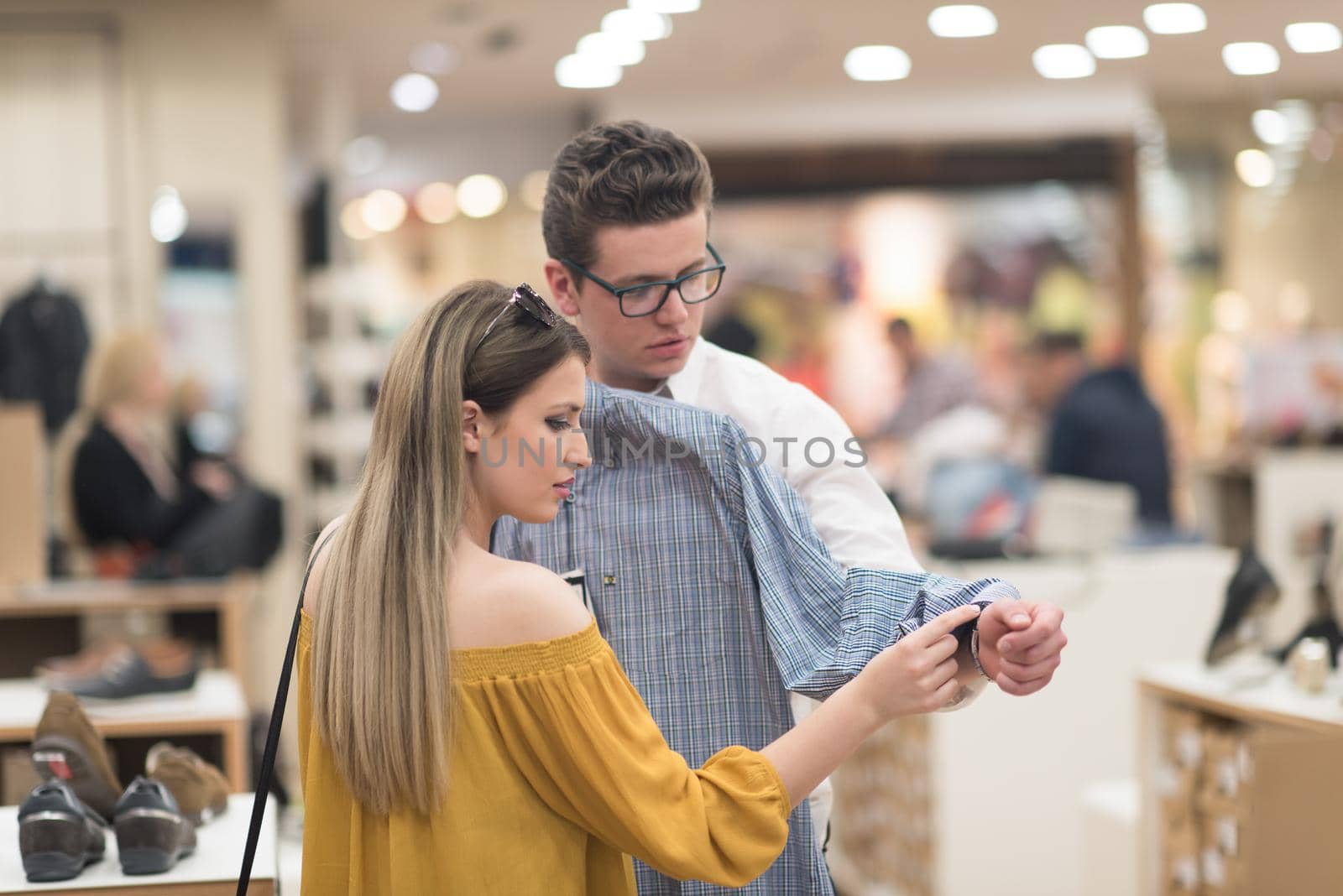 Attractive Couple Shopping In A Man's Clothing Store