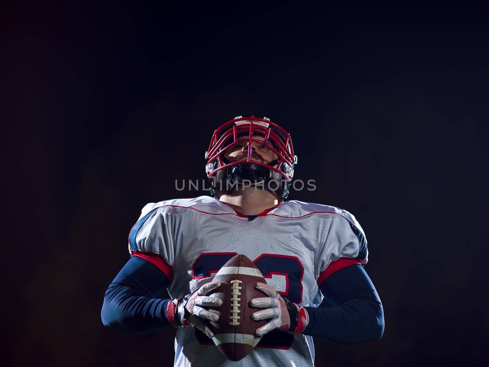 portrait of confident American football player by dotshock