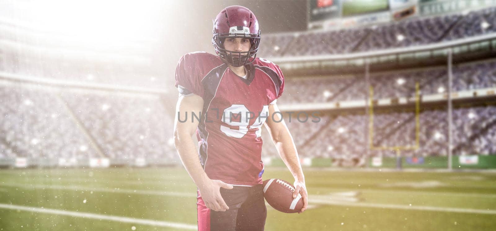 American Football Player isolated on big modern stadium field by dotshock