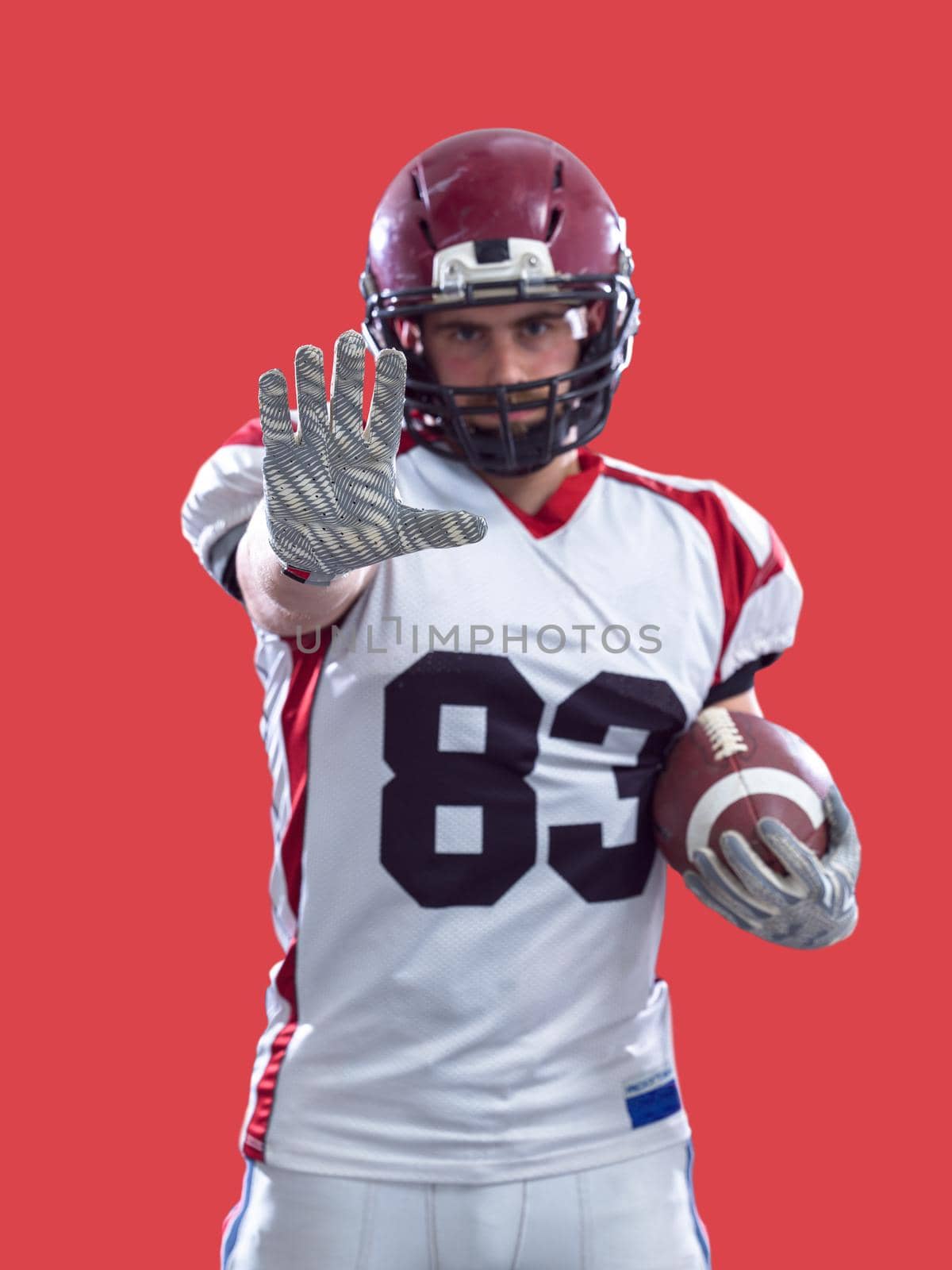 portrait of confident American football player by dotshock