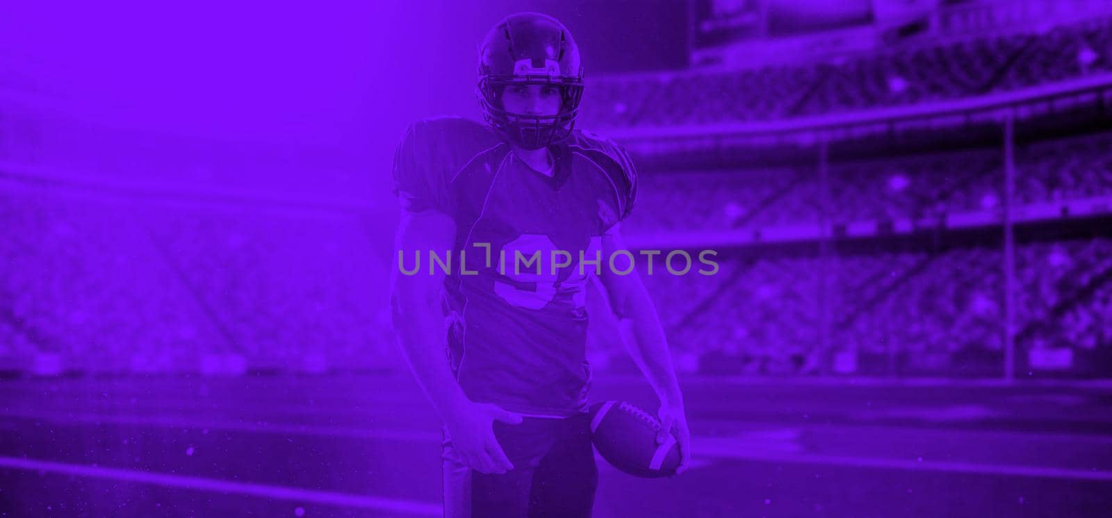 duo toned american football player in  arena at night by dotshock