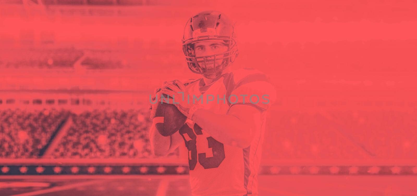 one quarterback american football player throwing ball on big modern stadium field with lights and flares