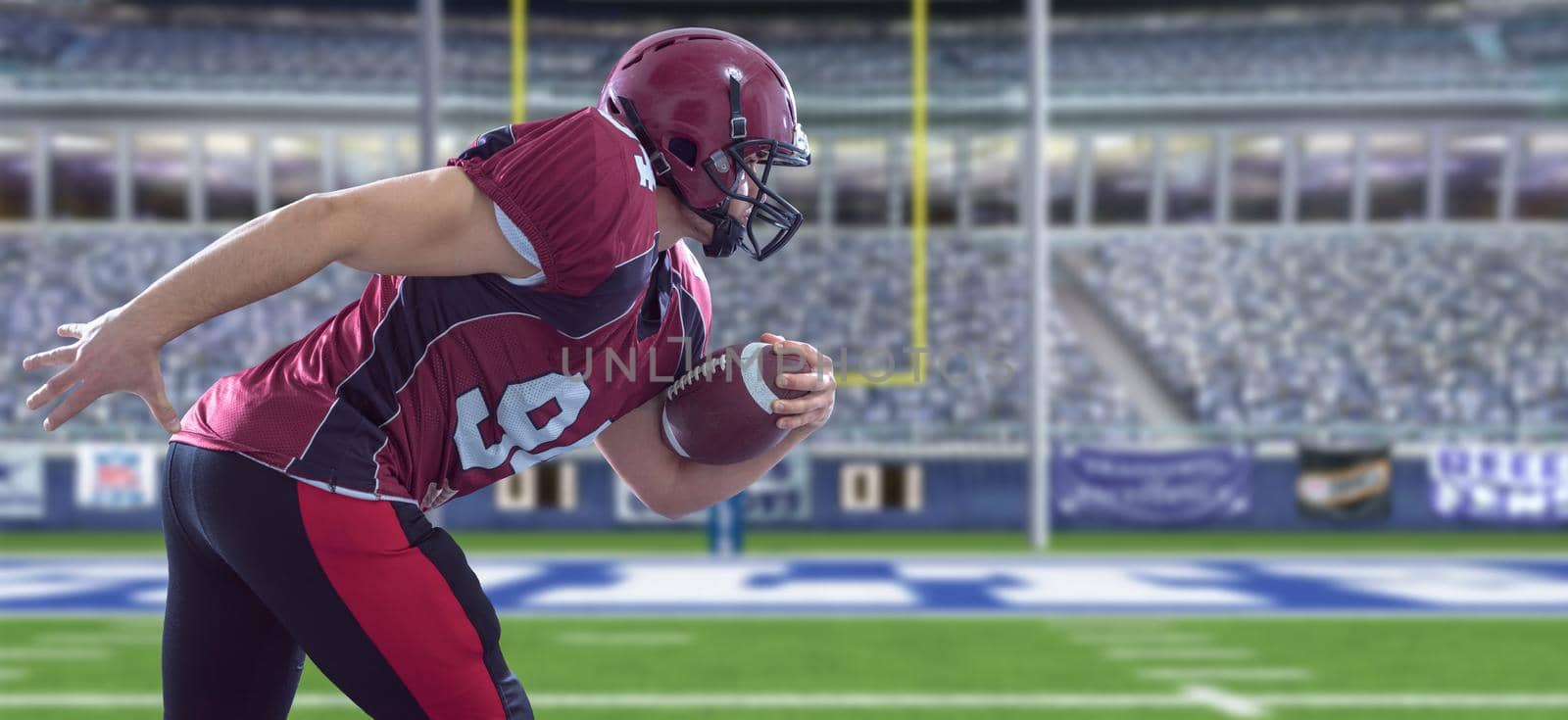 American football Player running with the ball isolated on big modern stadium field with lights and flares