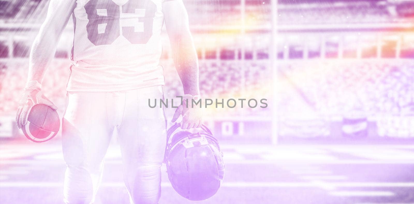 Closeup Portrait of a strong muscular American Football Player on big modern stadium field with lights and flares