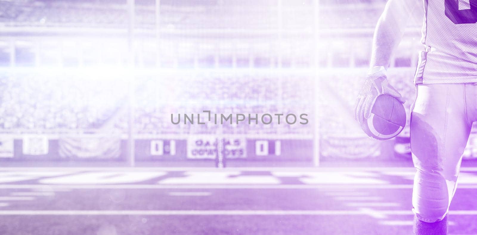 Closeup Portrait of a strong muscular American Football Player on big modern stadium field with lights and flares