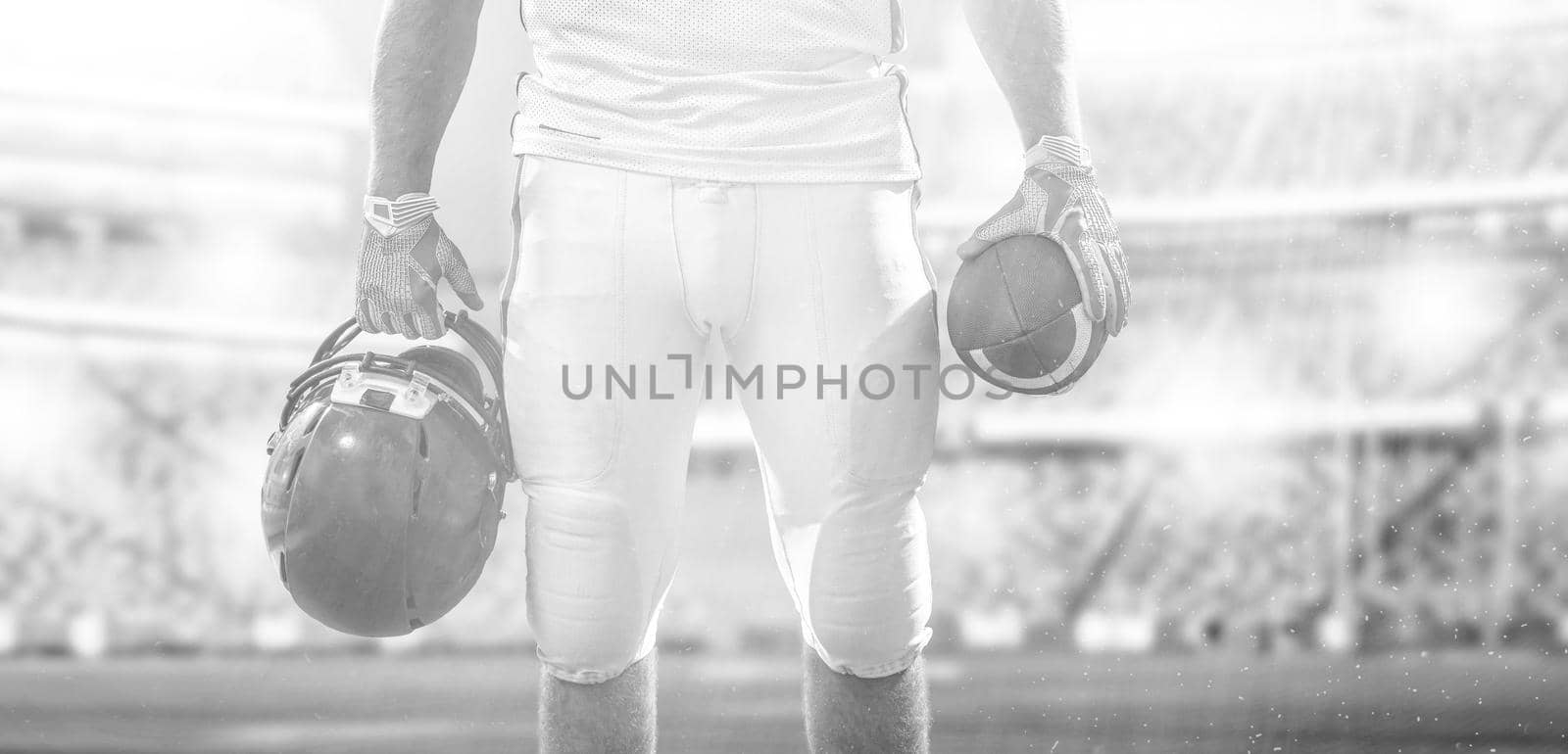 closeup American Football Player isolated on big modern stadium by dotshock