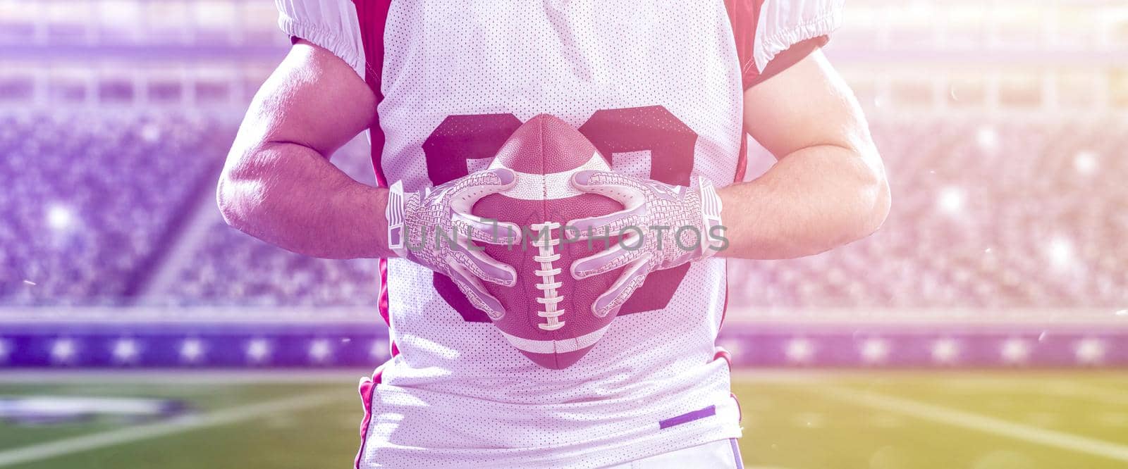 closeup American Football Player isolated on big modern stadium by dotshock