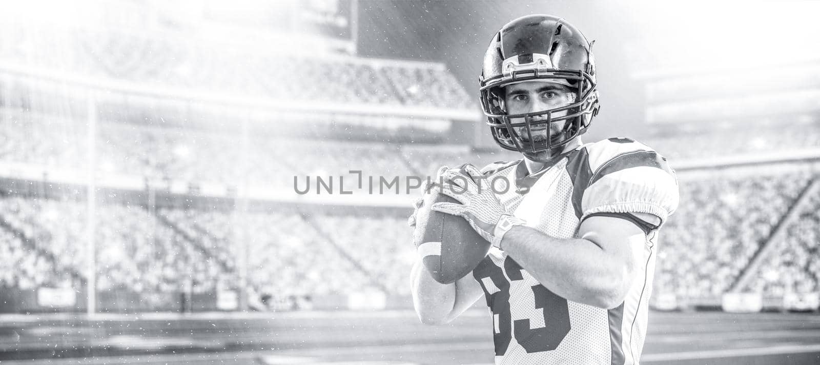 one quarterback american football player throwing ball isolated on big modern stadium field with lights and flares