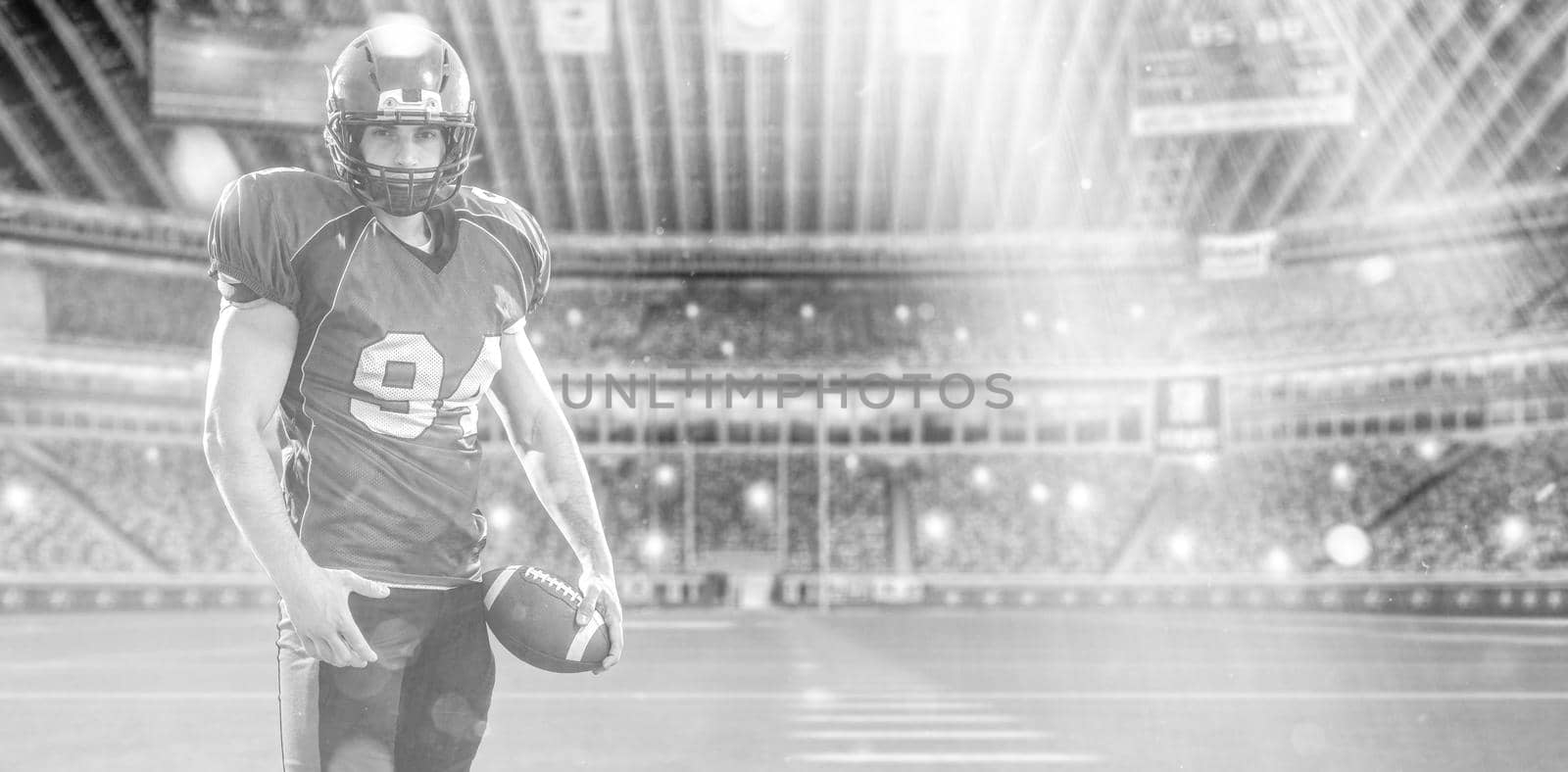 American Football Player isolated on big modern stadium field by dotshock