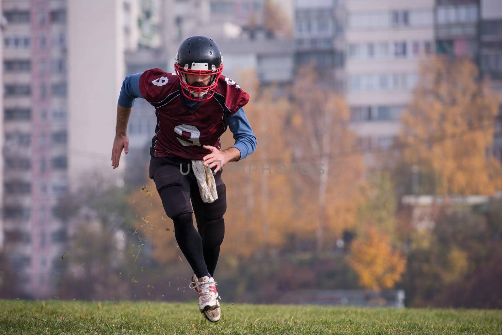 american football player in action by dotshock