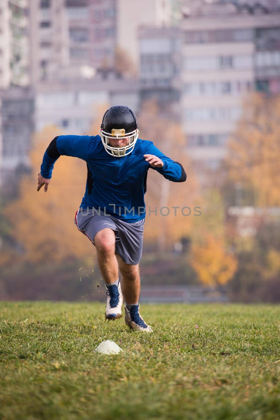 young american football player in action during the training at field