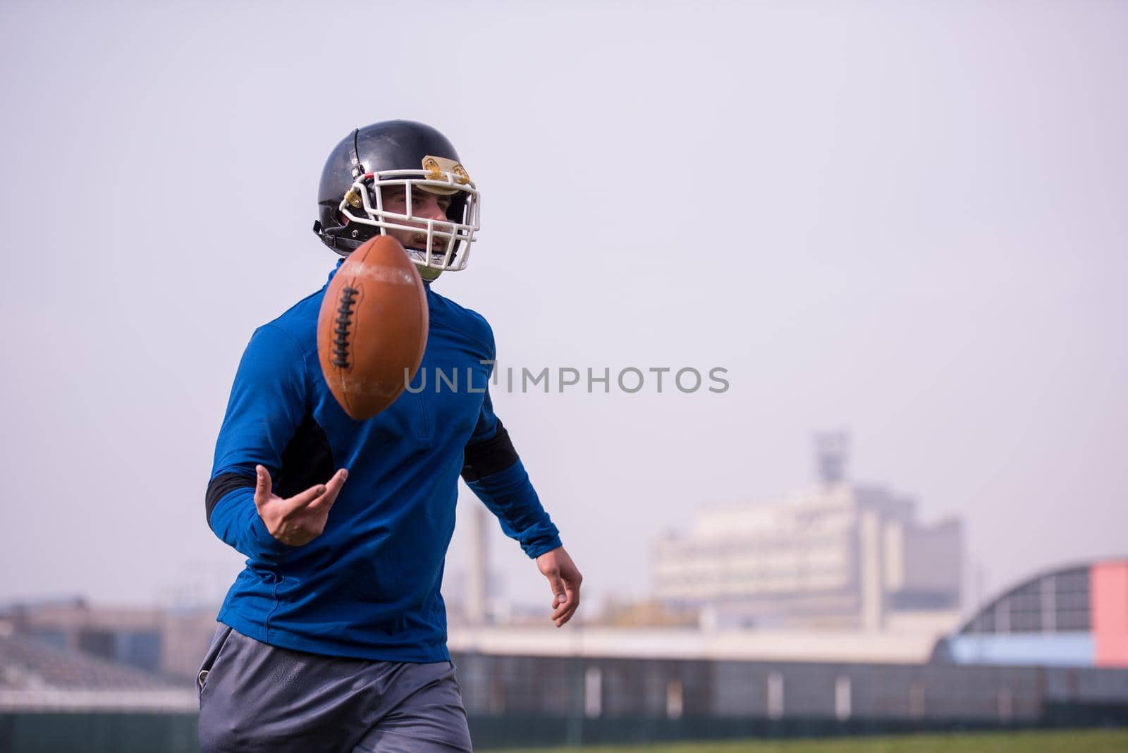 young american football player in action during the training at field