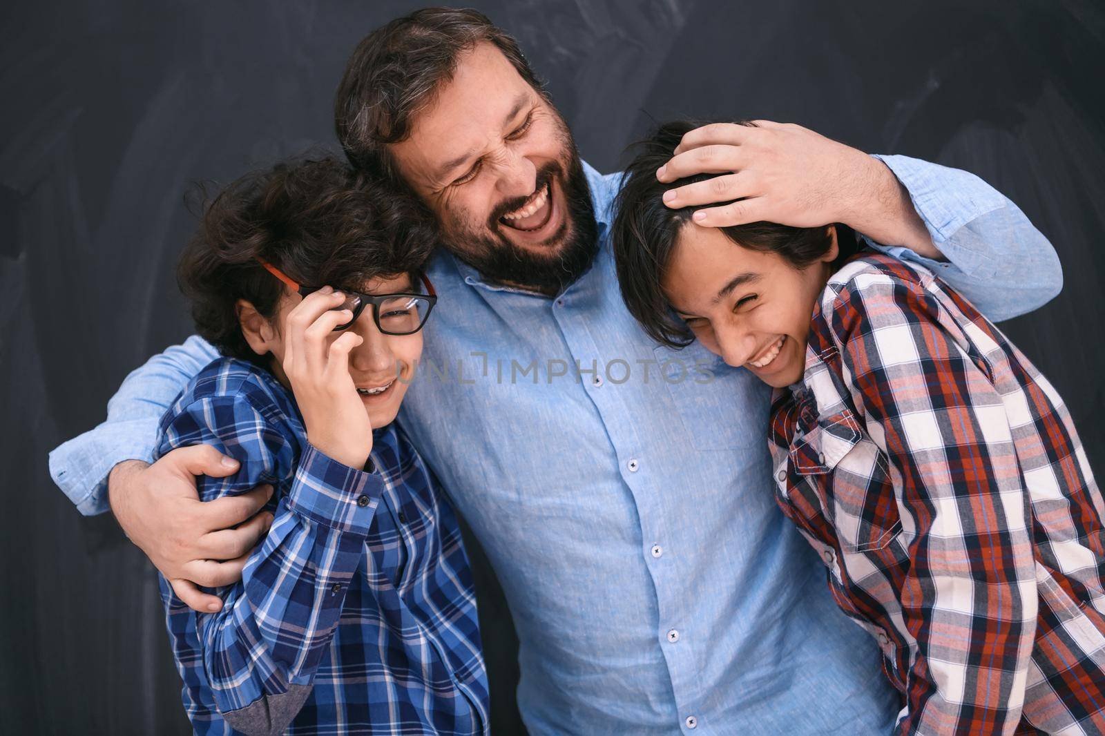 happy father hugging sons unforgettable moments of family joy in mixed race middle eastern Arab family. High quality photo