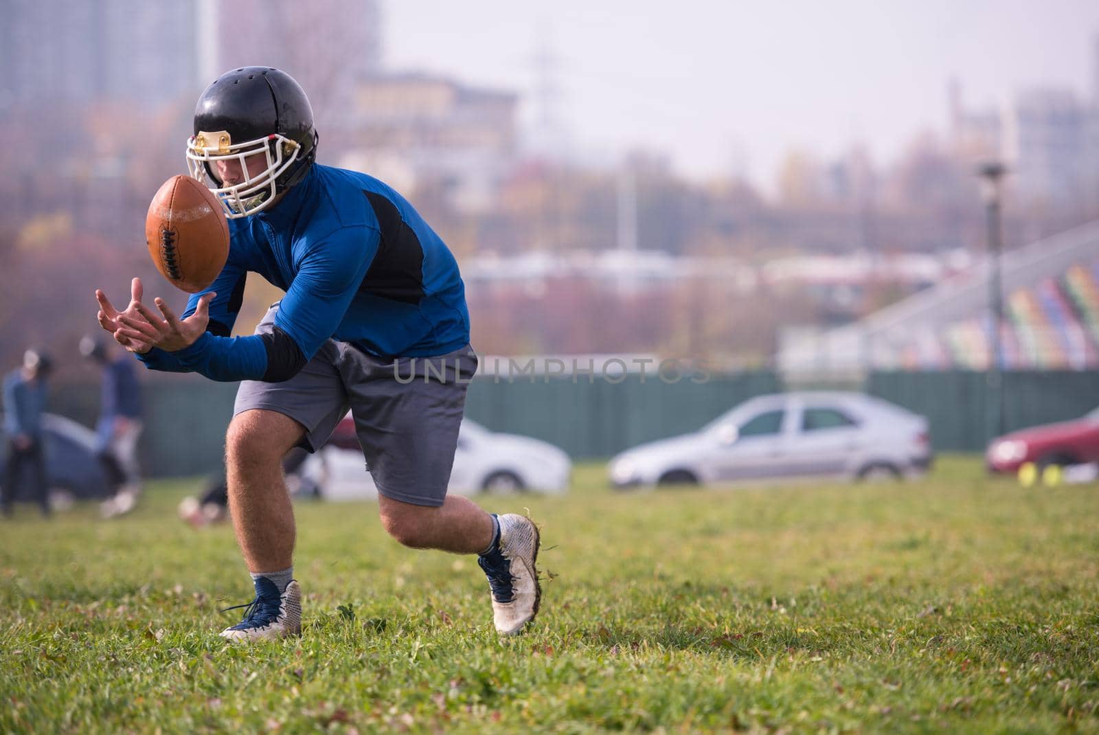 group of young american football players in action during the training at field