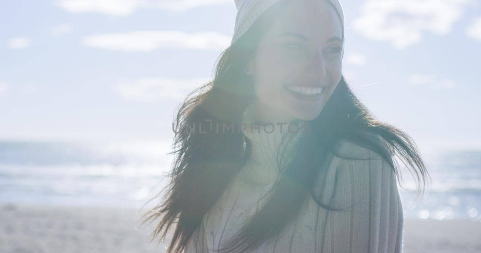 Girl In Autumn Clothes Smiling on beach by dotshock