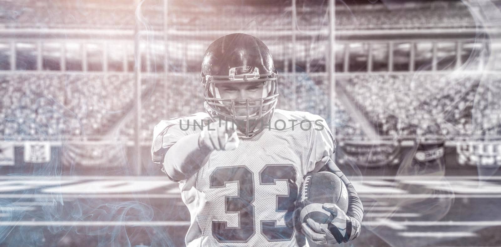 portrait of confident American football player by dotshock