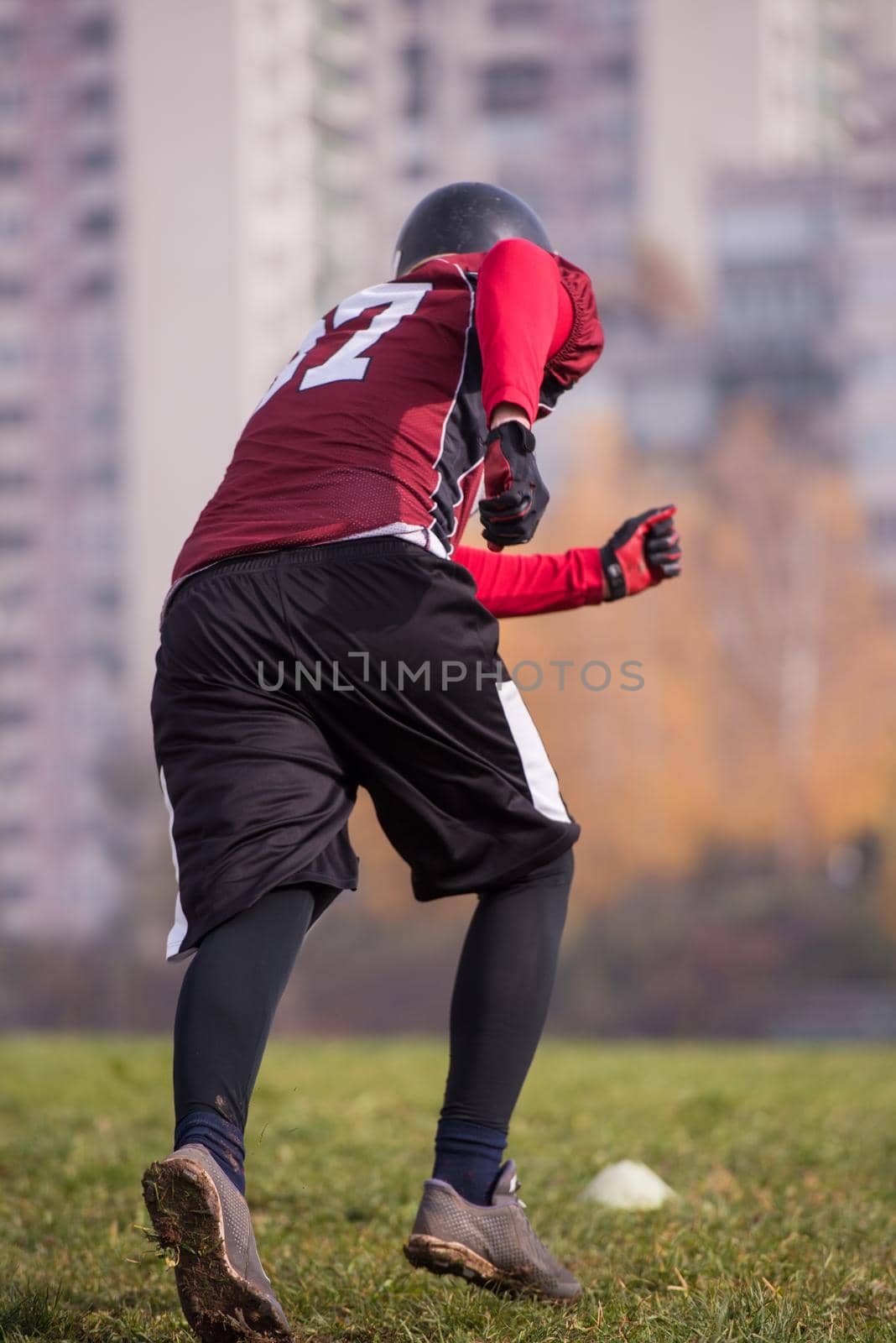 young american football player in action during the training at field