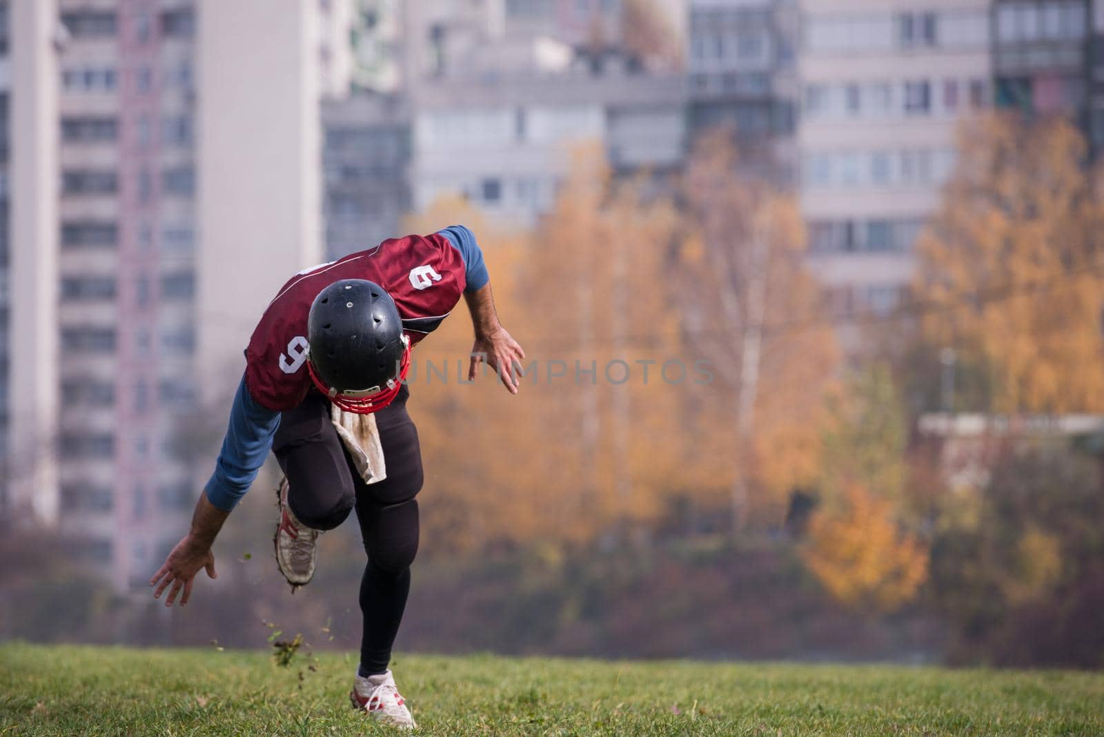 young american football player in action during the training at field