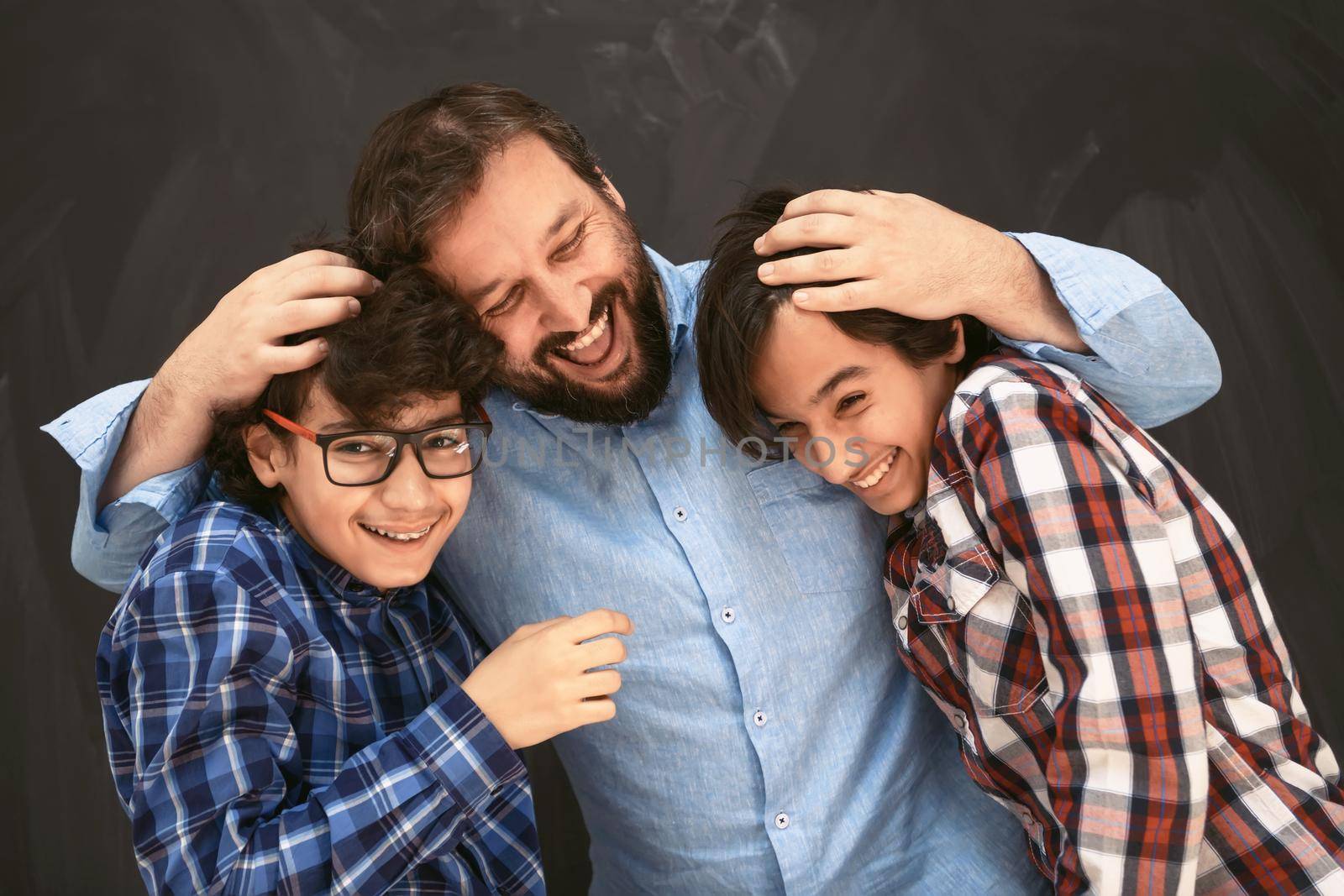 happy father hugging sons unforgettable moments of family joy in mixed race middle eastern Arab family. High quality photo