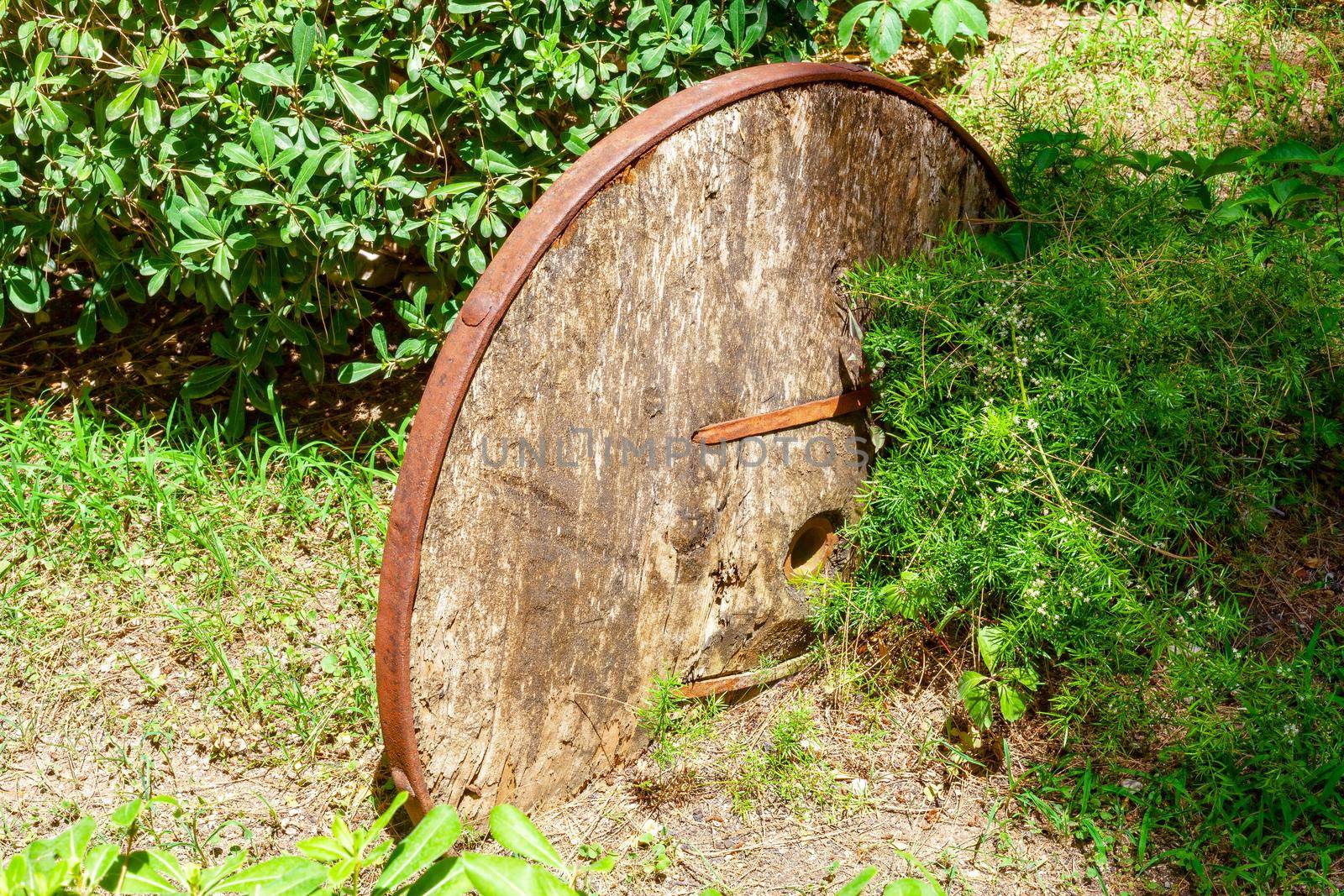 An old, sprawling wooden cart with large wooden wheels. Turkey Kemer.