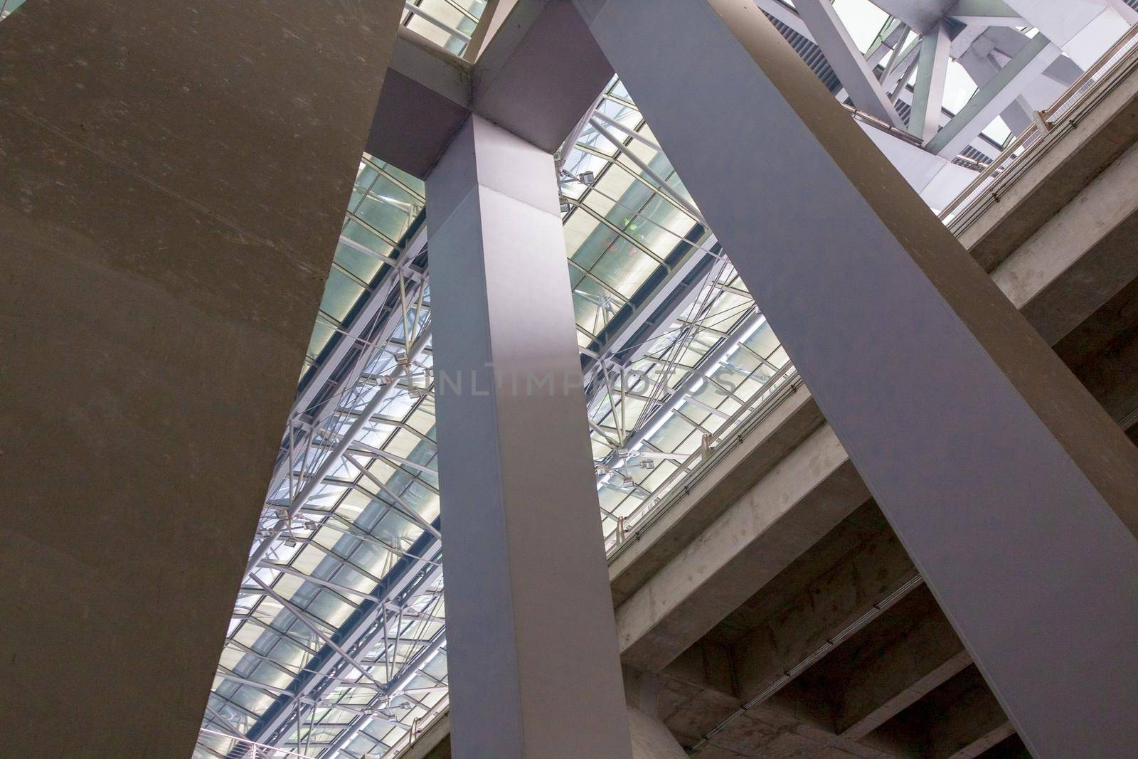 Powerful square columns going up and supporting the roof of the terminal.