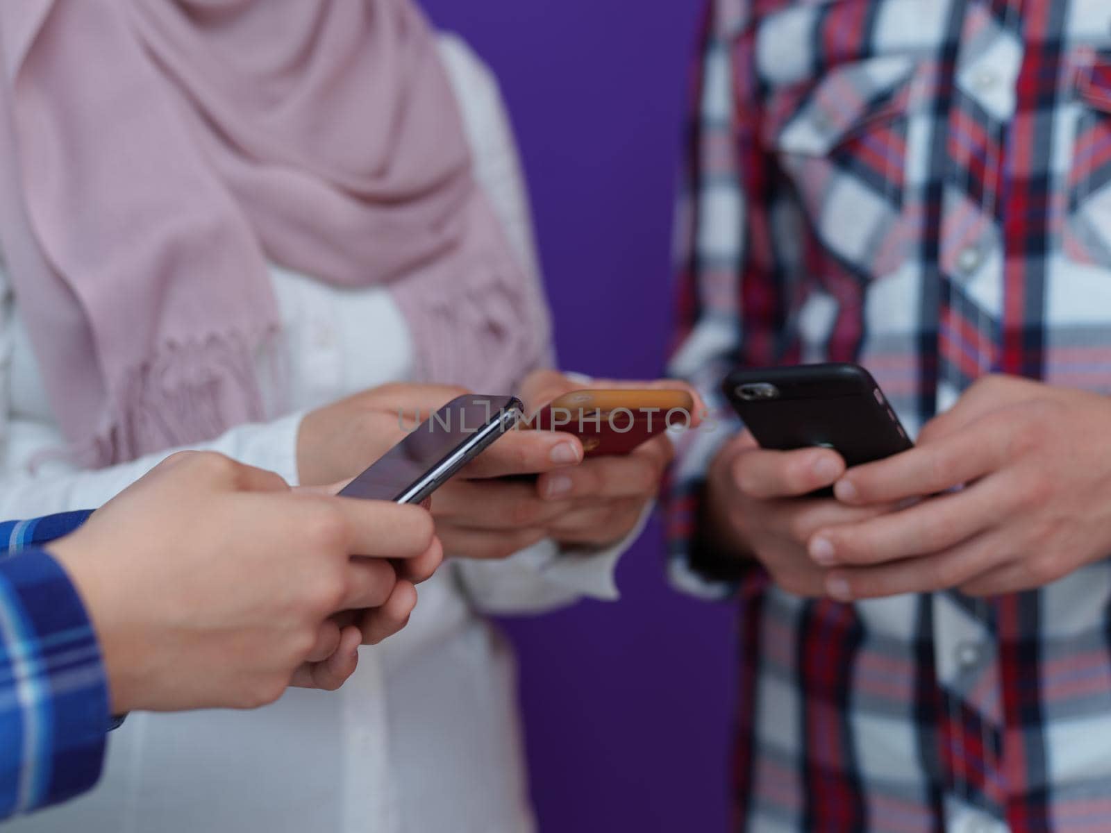 arab teenagers group using smart phones for social media networking and sharing of informations for online education