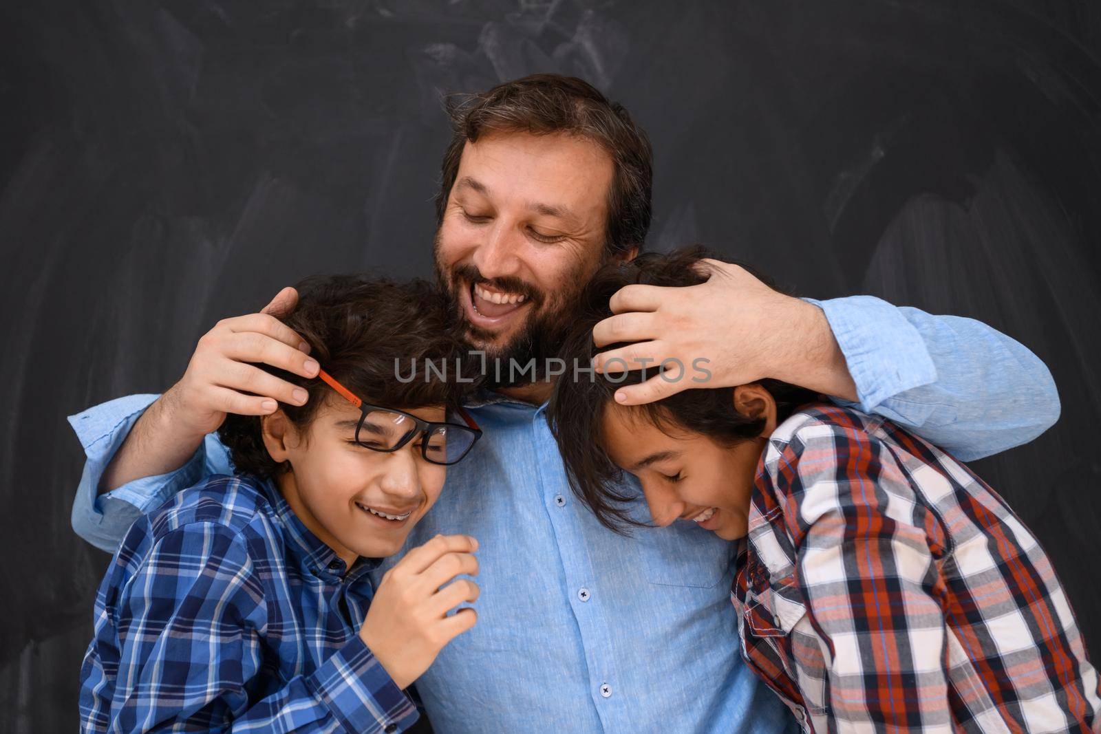 happy father hugging sons unforgettable moments of family joy in mixed race middle eastern Arab family. High quality photo