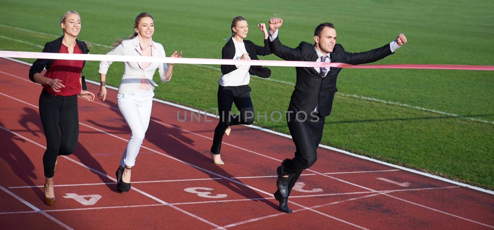 business people running on racing track by dotshock