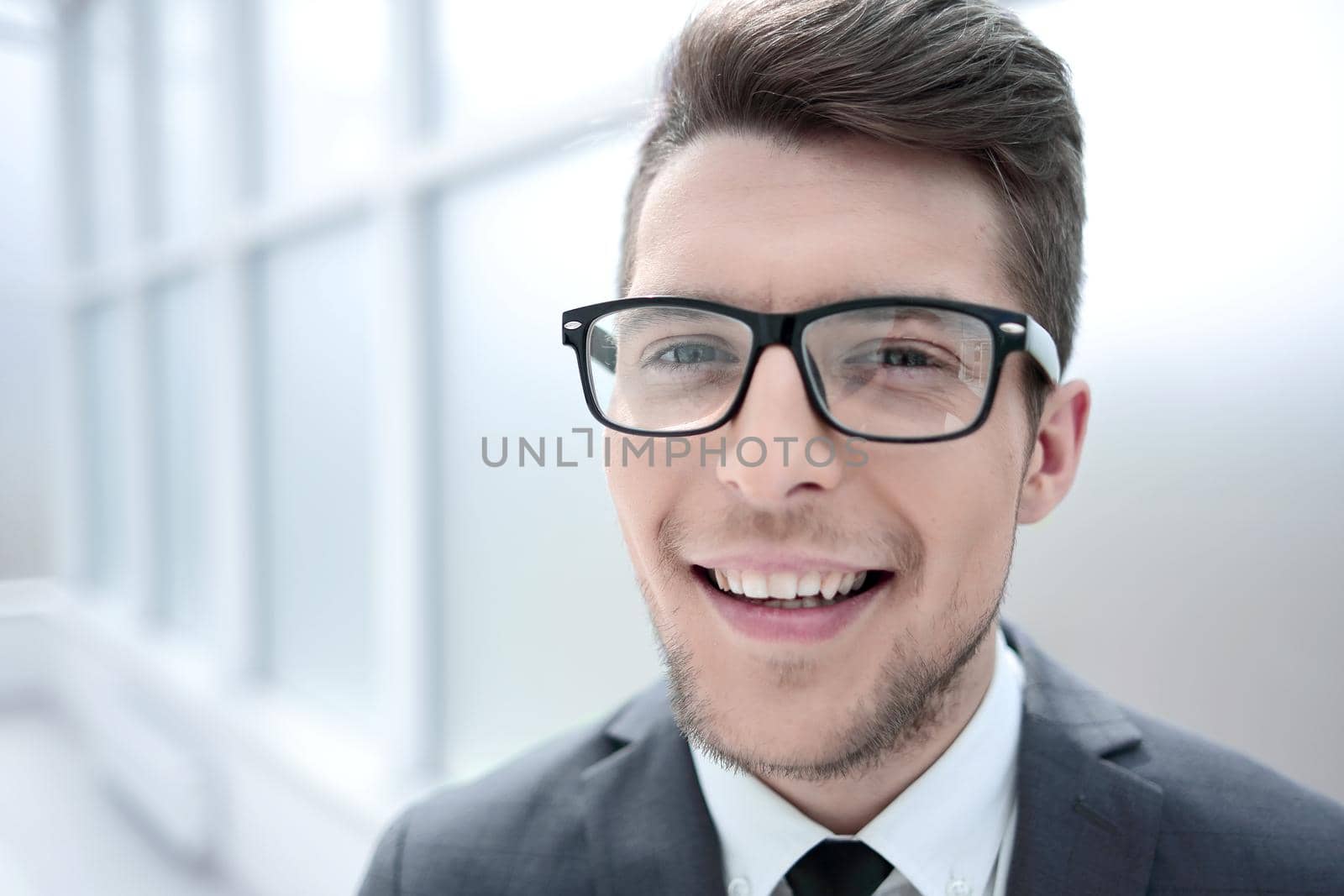 close up.portrait of a young businessman on a light background